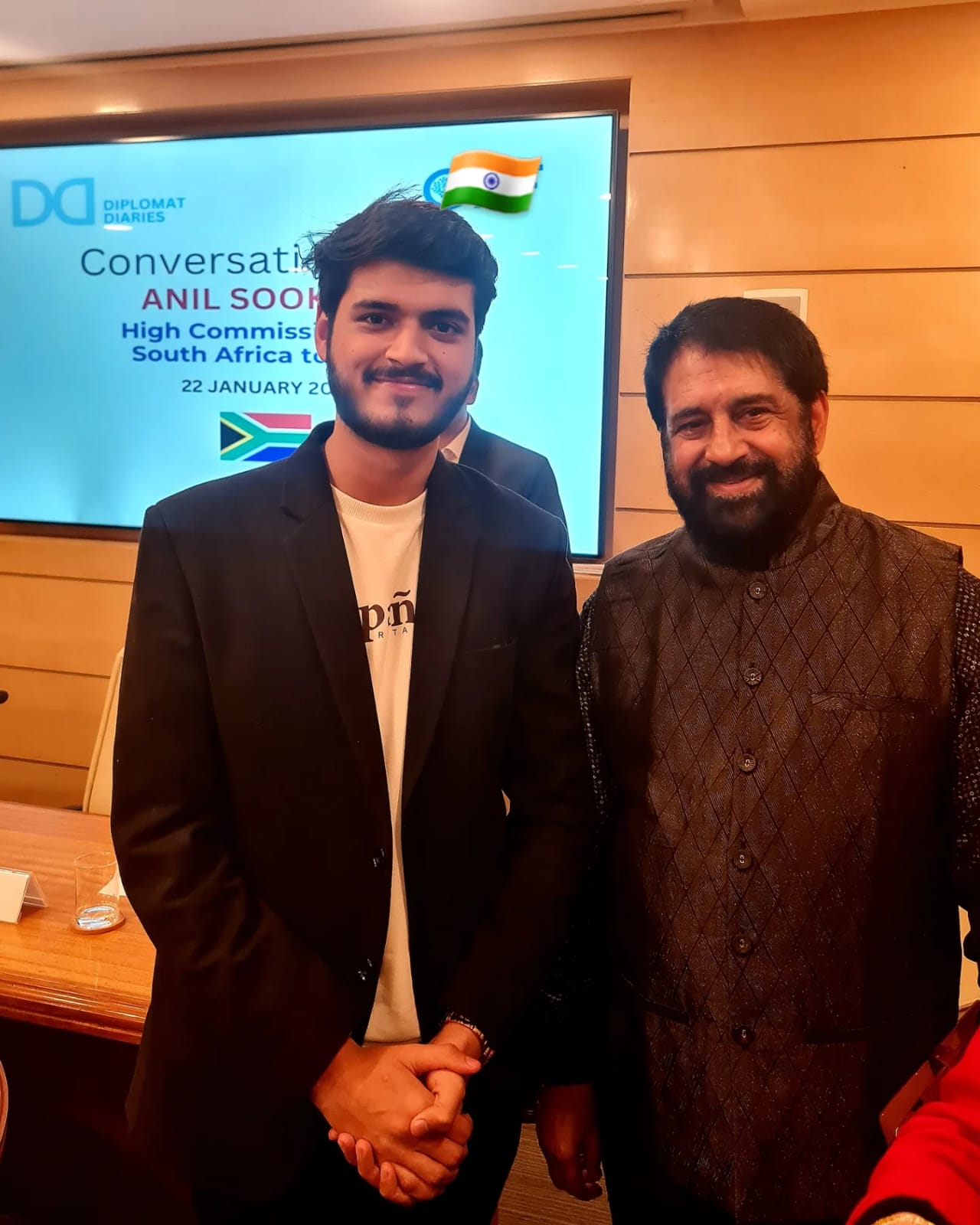 Akshat Mehrotra posing with High Commissioner Anil Sooklal of South Africa.